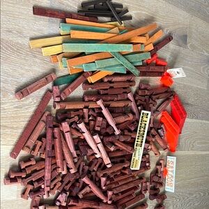 Lincoln Log pieces. Vintage. Assortment of sizes, signs, roof pieces, etc.